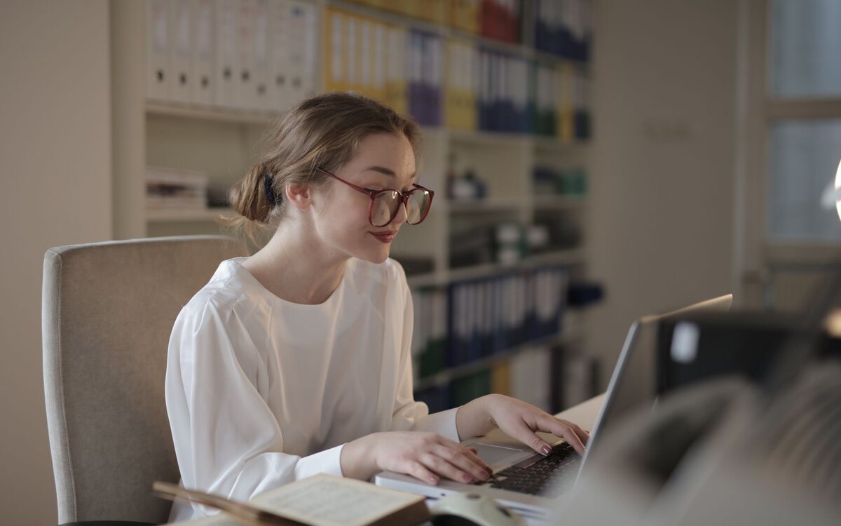 Woman working at a computer in an office