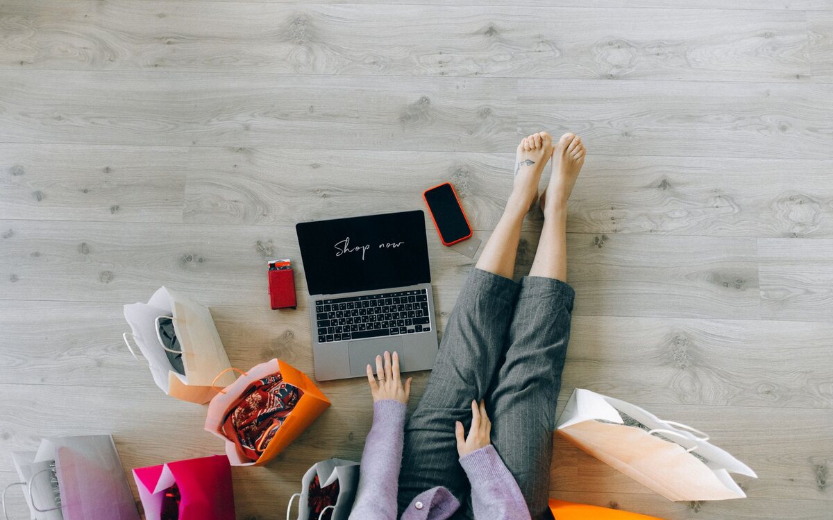 Woman shopping online on a laptop at home