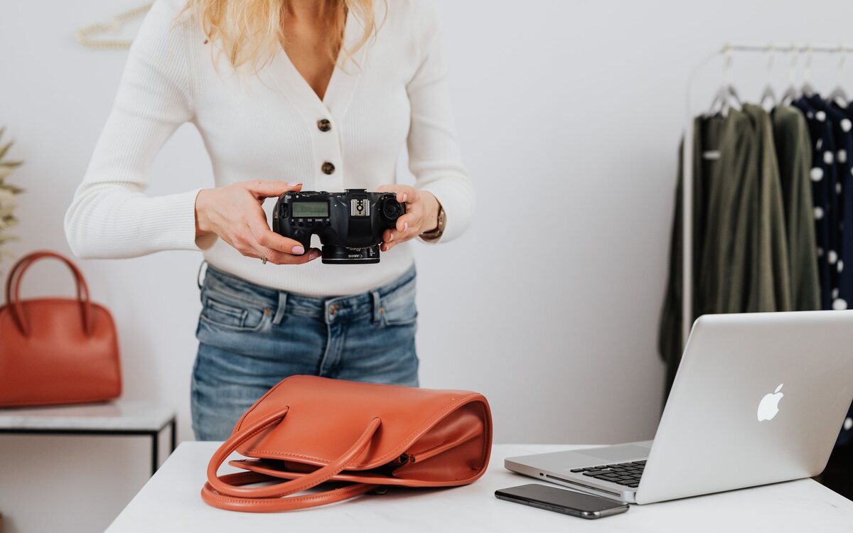 Woman photographing a product with a phone