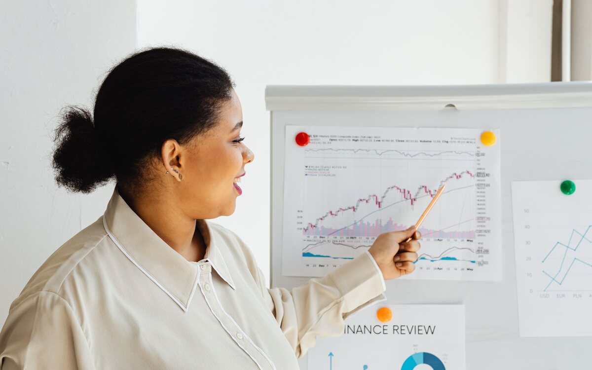 Professional presenting a chart in a meeting